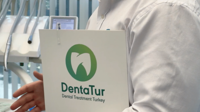 Dental professional holding a personalized treatment plan folder from DentaTur Dental Clinic in Turkey